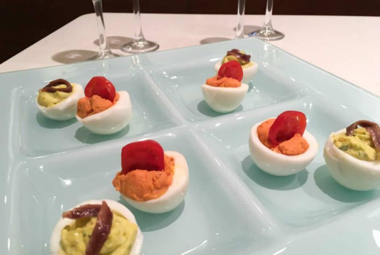 Italian Deviled Eggs with Pesto Genovese and Tomato Sauce