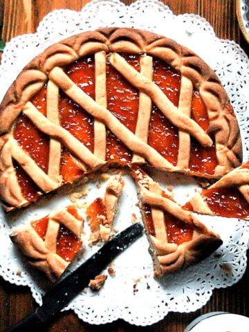 Traditional Italian crostata with apricot jam and lattice crust