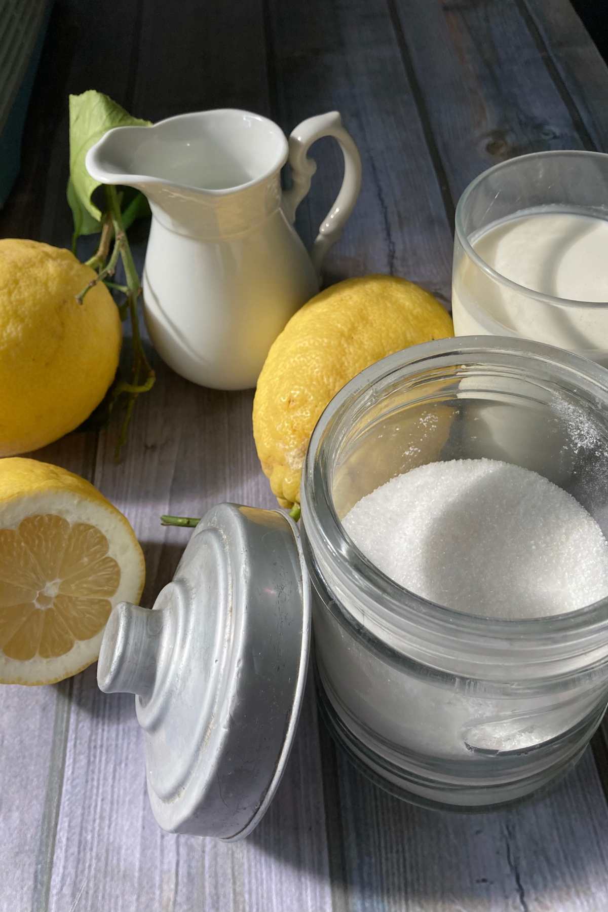 lemon gelato ingredients with fresh lemons, milk, cream and sugar