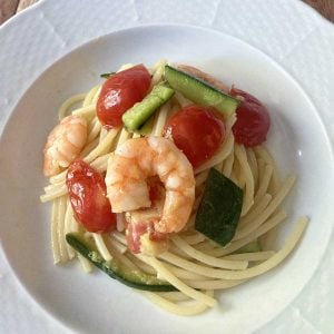 shrimp with zucchini pasta and cherry tomatoes