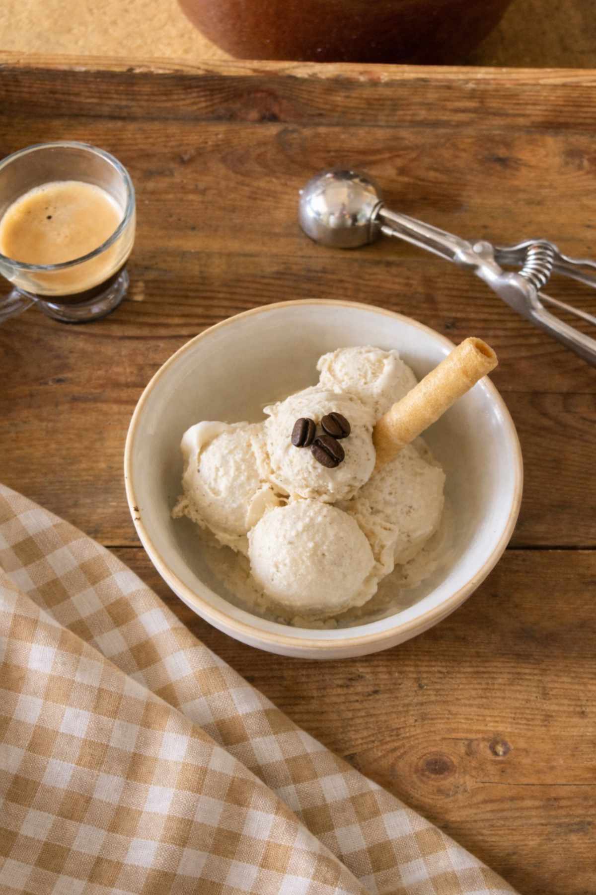 homemade coffee gelato served in a bowl with espresso and wafer