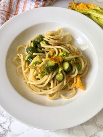 zucchini flower pasta with sliced zucchini and lemon zest