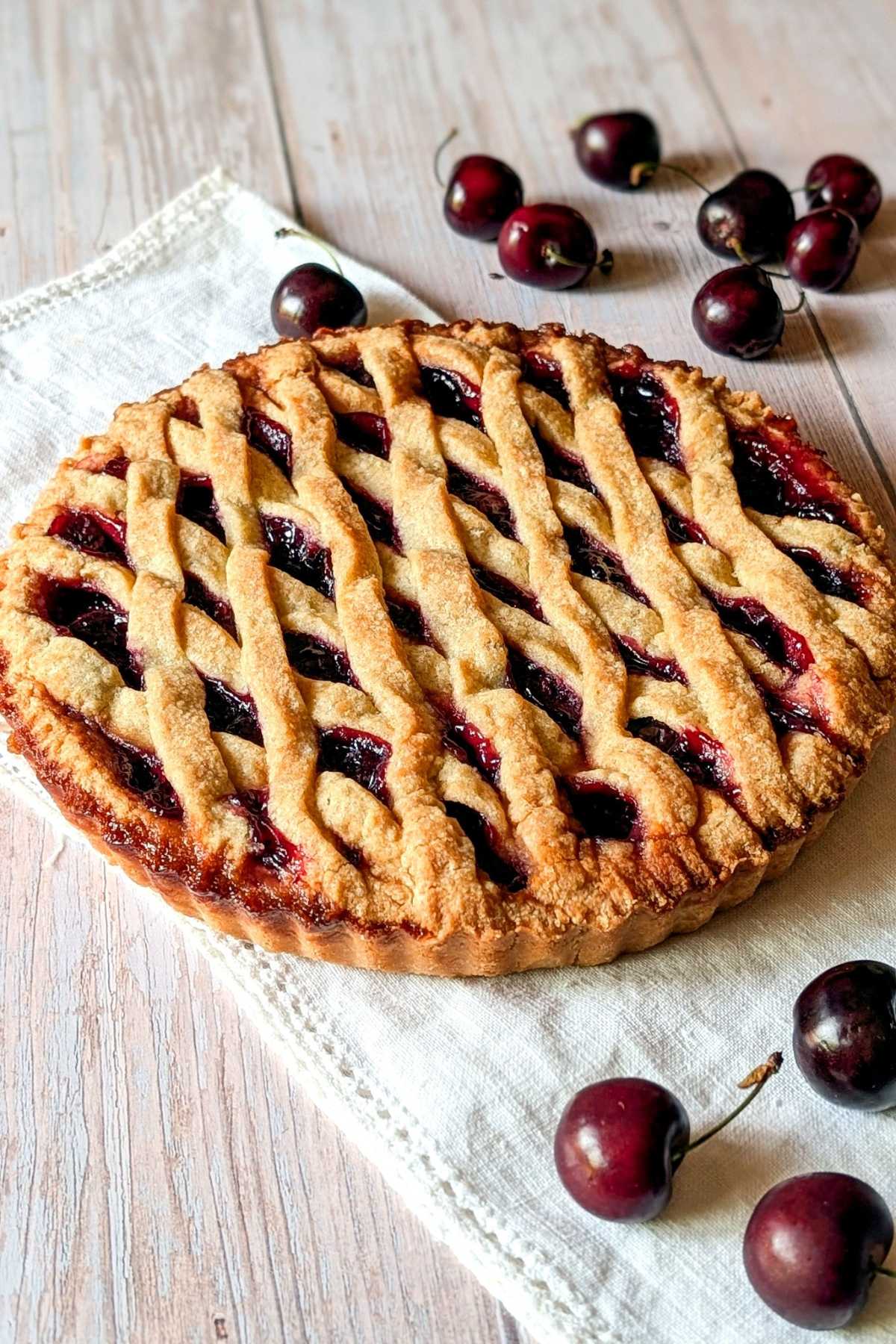 Fresh cherry crostata with pasta frolla lattice crust